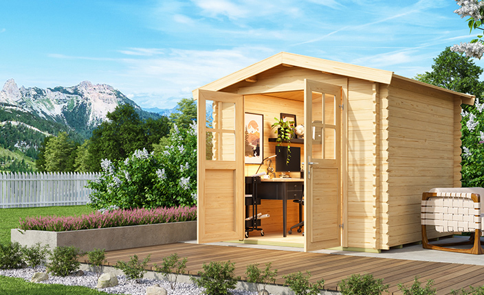 Gartenhaus aus Holz in grünem Garten